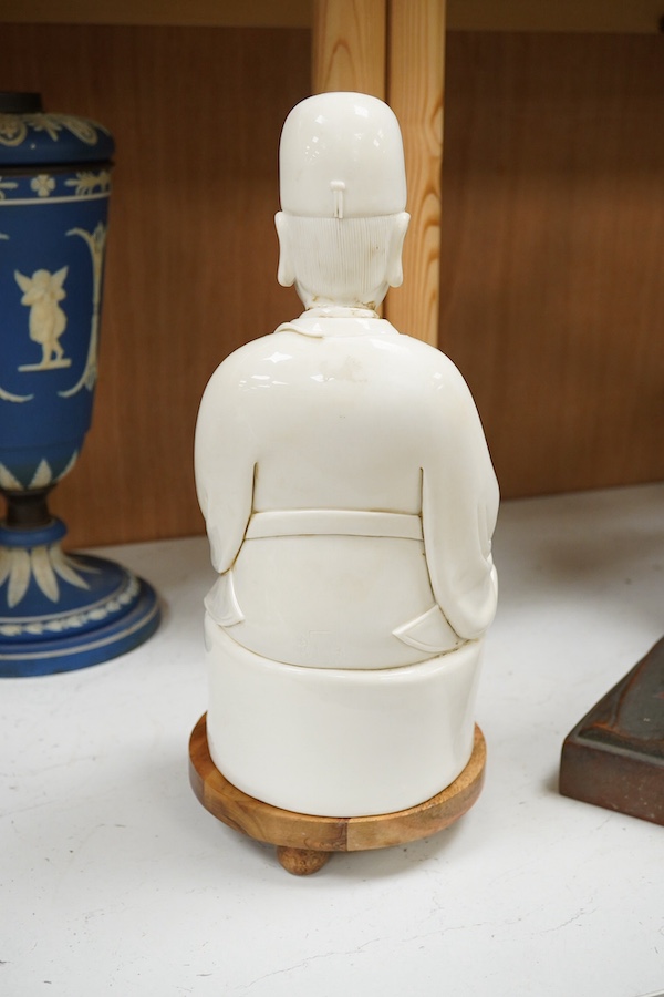 A Chinese white glazed pottery figure of Wenchang Wang, 37cm high. Condition - good